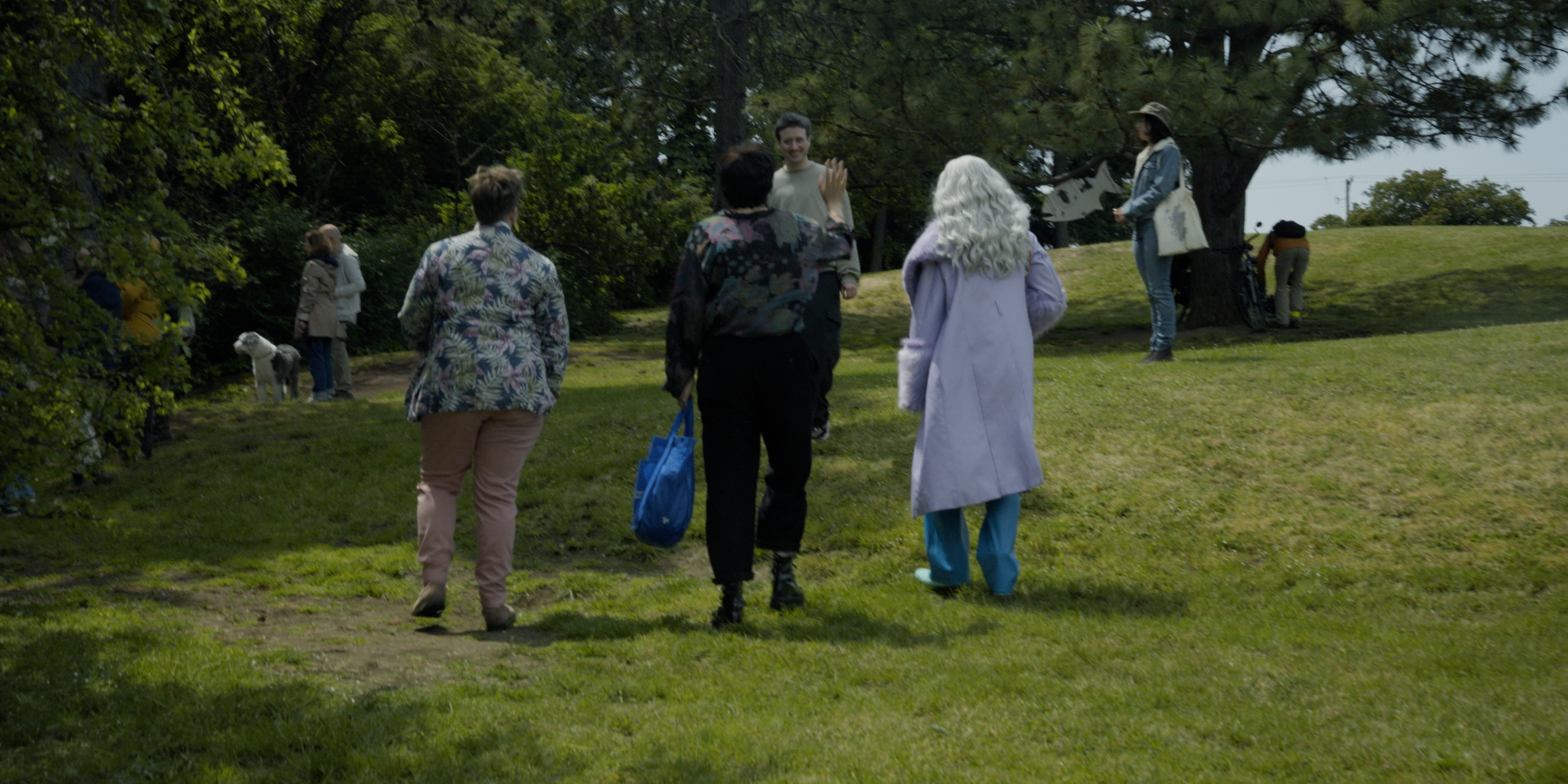 Group of performers and community members gathering outdoors in a park in Victoria Ka Raja
